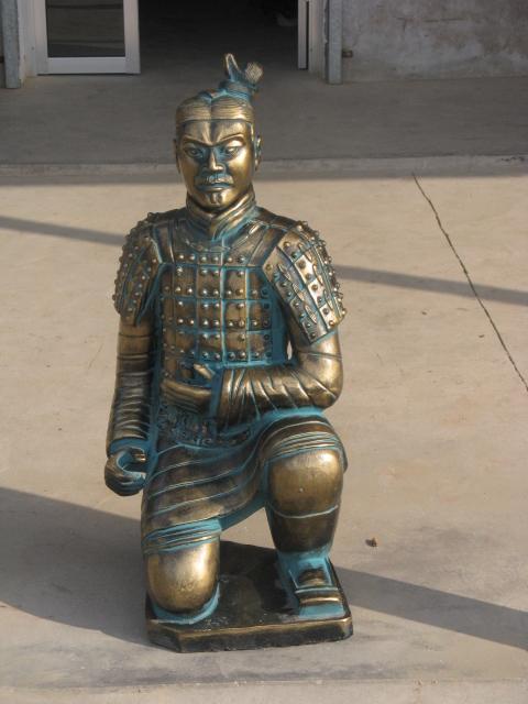 bronze kneeling warrior statue