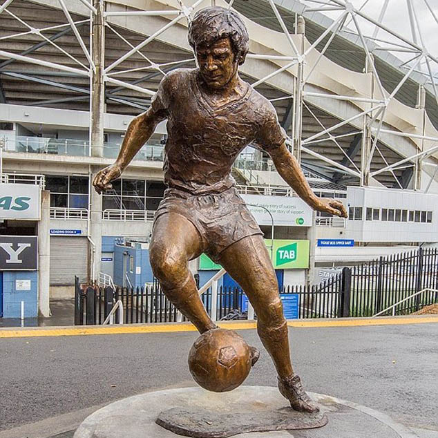 bronze football player sculpture