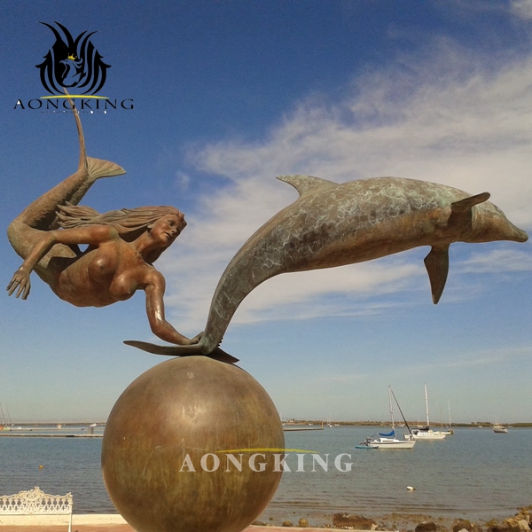 bronze girl dolphin sculpture