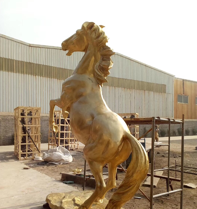 large golden sculpture horse