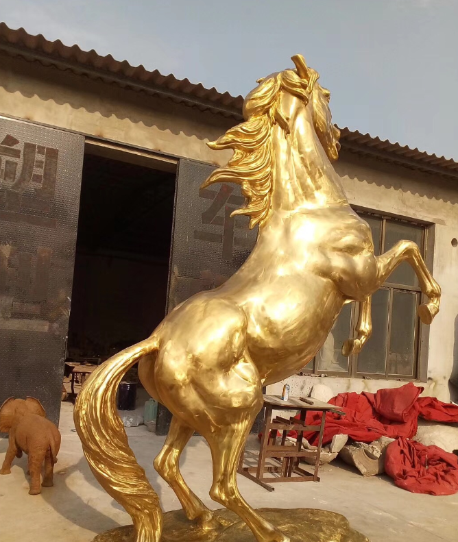 life-size golden sculpture horse