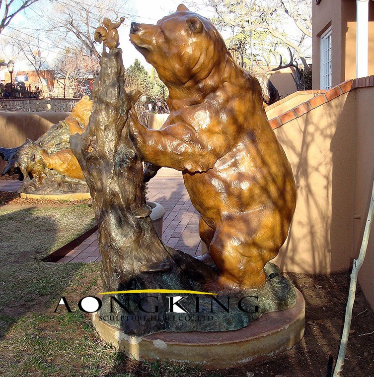 Bronze bear statue with squirrel