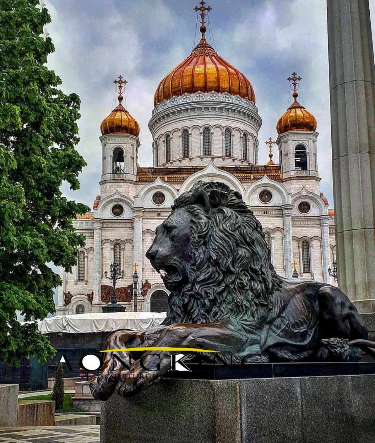 Bronze statue of lion resting