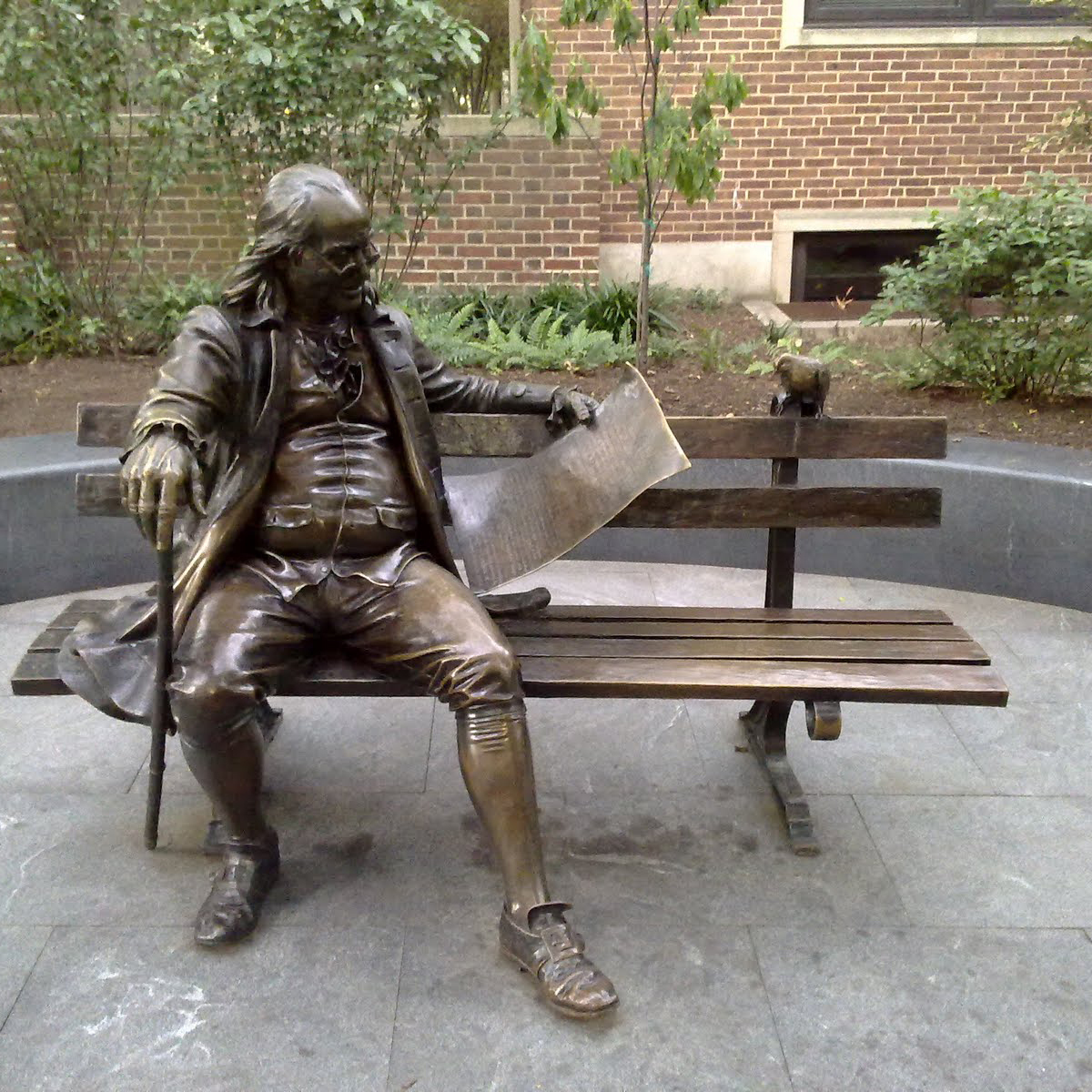 Bronze statue of at ben on the bench