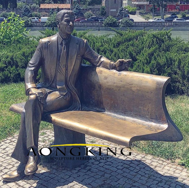 Famous man sitting on bench statue