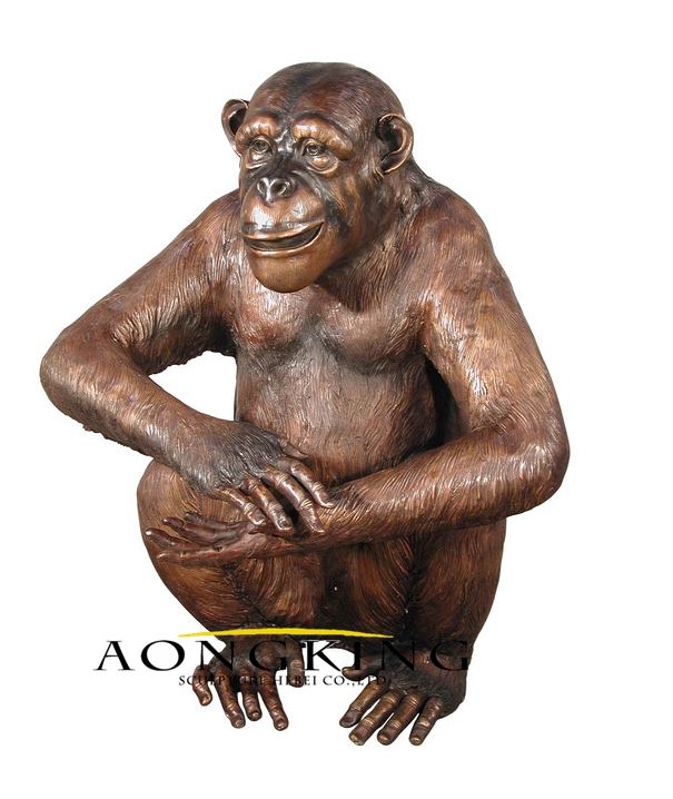 Life size sitting monkey sculpture