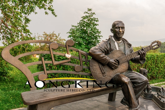 Playing guitar statue
