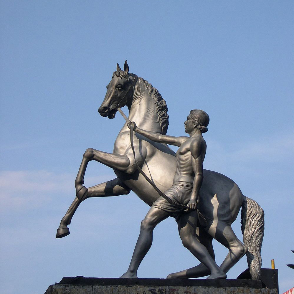 Sculpture of pedestrian with horse