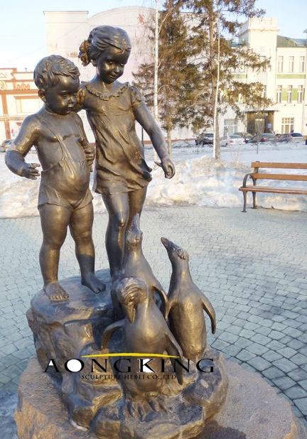 Sculpture of siblings and penguins