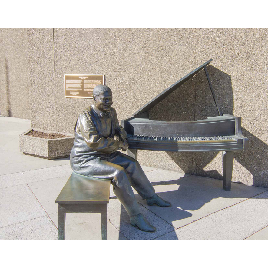 Sculpture playing a piano