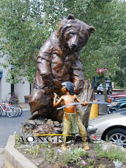 Statue of bear with little boy