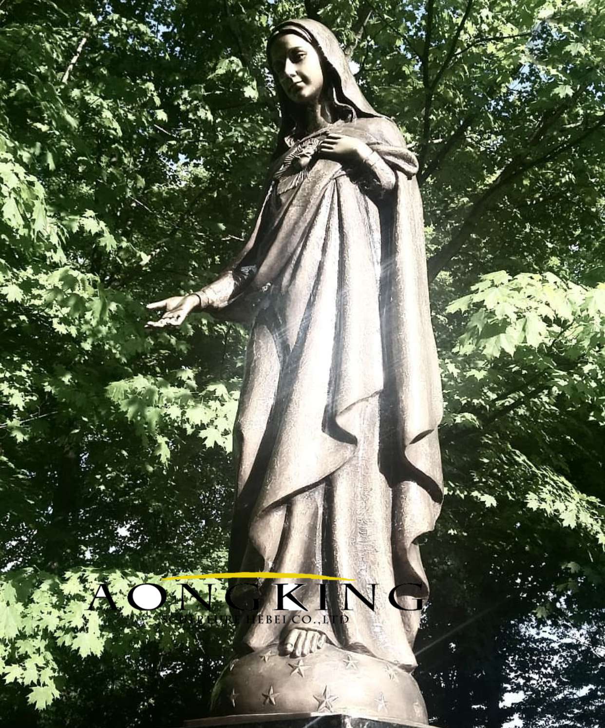 Statue of maria standing on a pedestal in the hemisphere