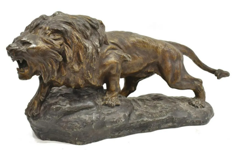 bronze statue of a roaring lion