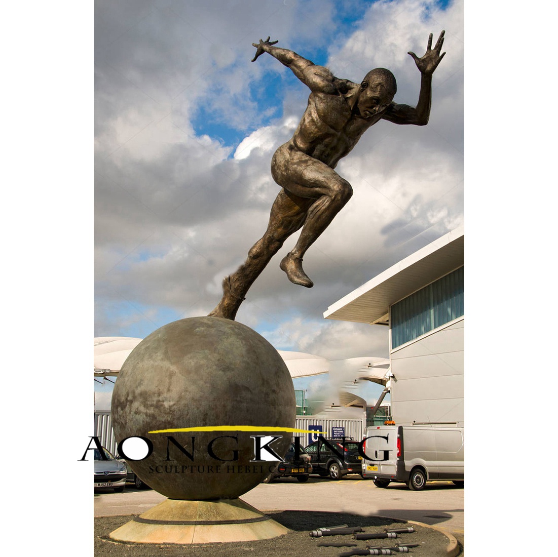 Abstract running on a ball man bronze statue
