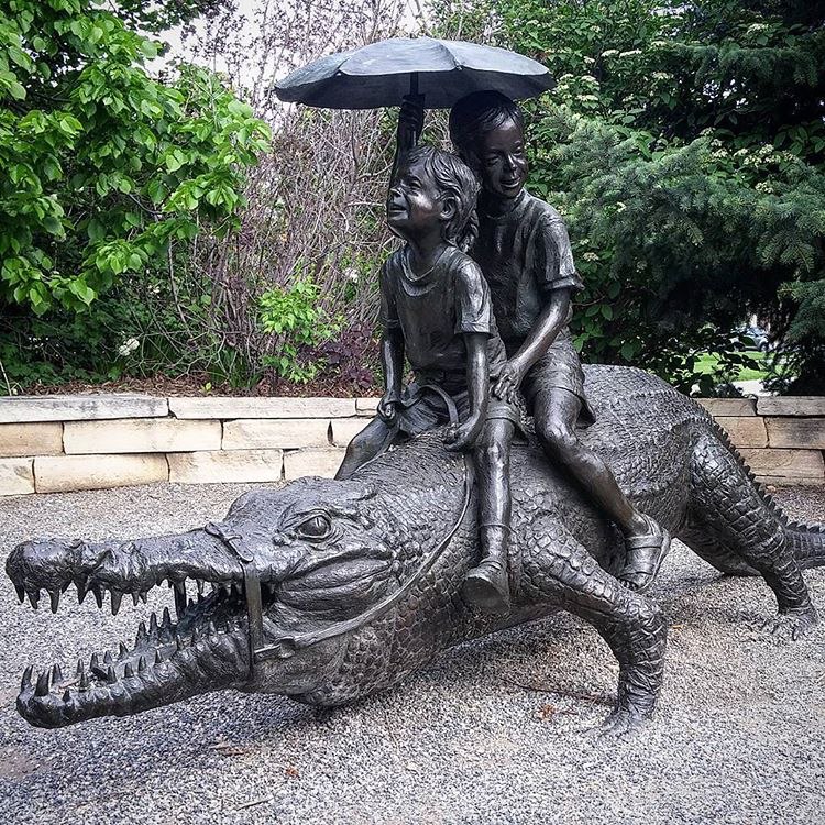 Crocodile sculpture with children