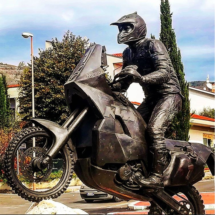 Rallying motorcycle racer statue
