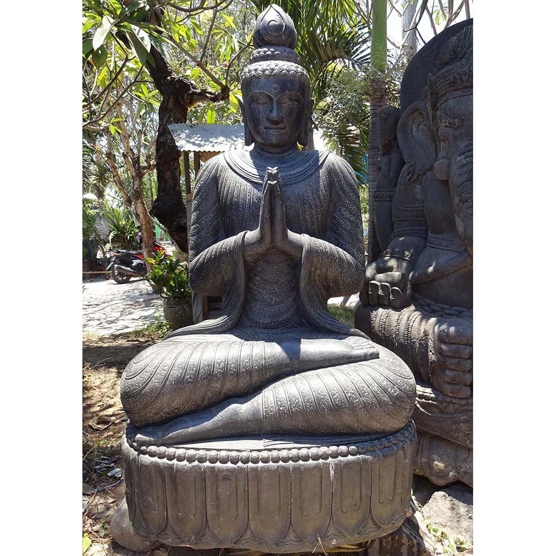Marble buddha statue with folded hands