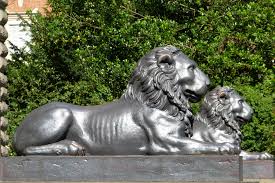 Lying bronze lion statue