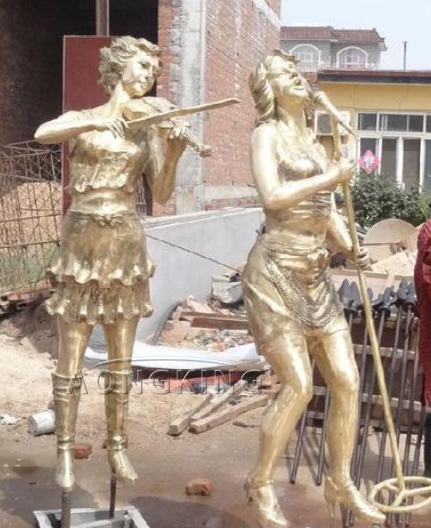 Playing music woman statues