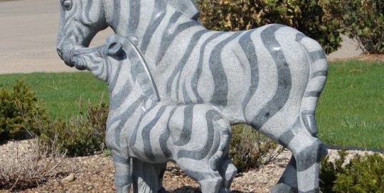 Stone zebra statue with baby