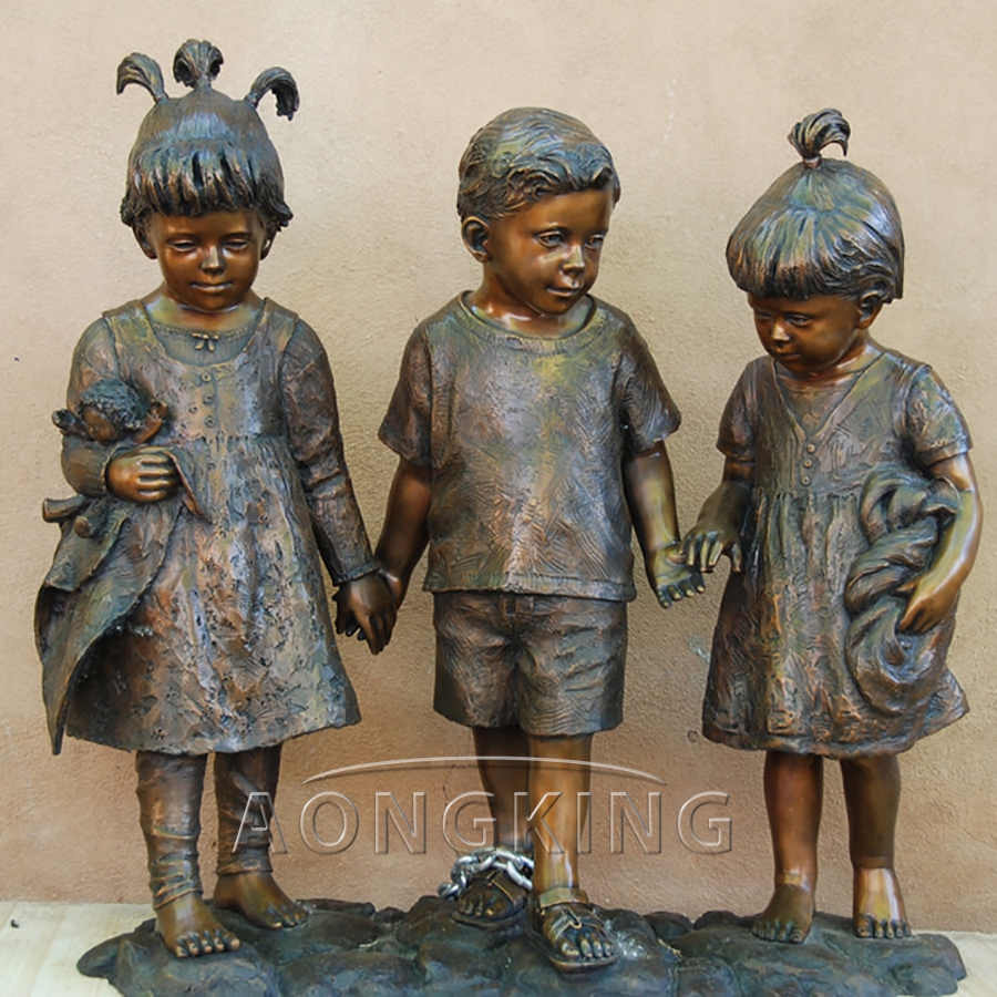 Three kids bronze statue