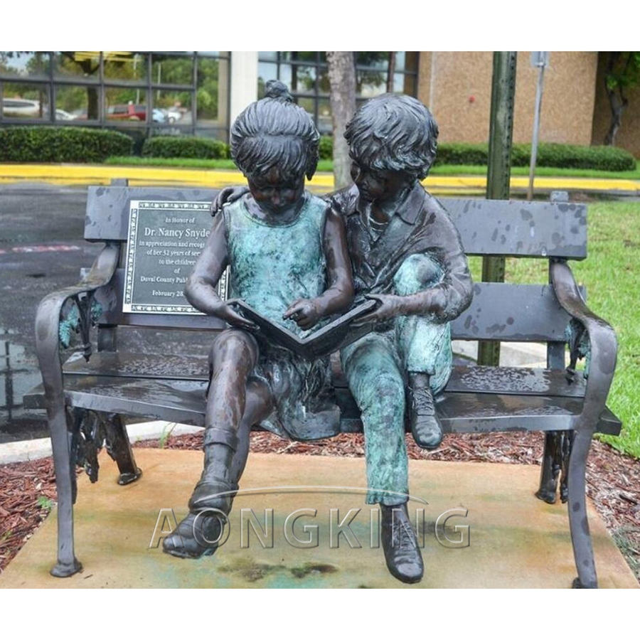 Reading children bronze statue 