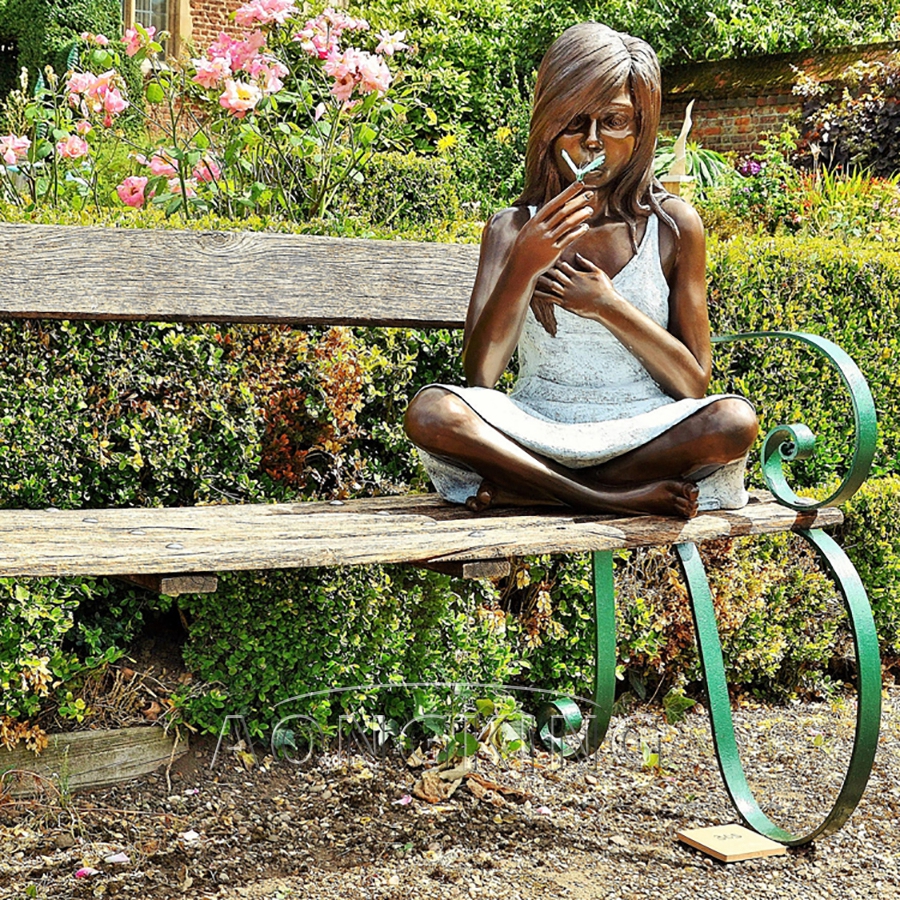 Sitting girl bronze statue