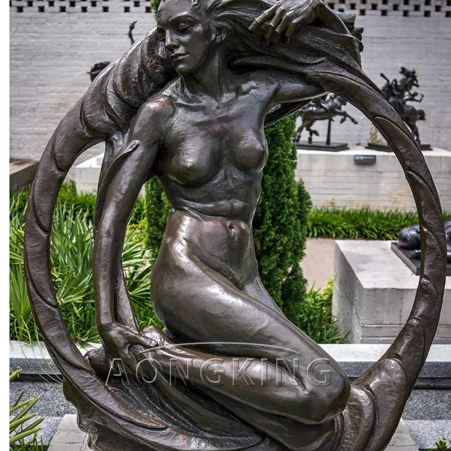 Sitting woman bronze statue