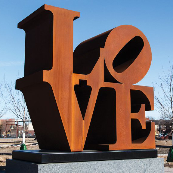 Corten steel love sculpture in park