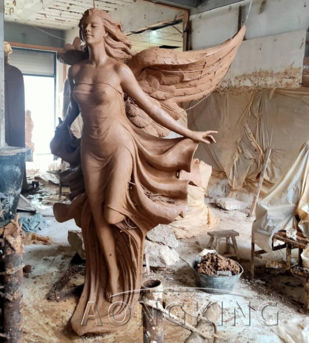 clay statue maiden of flying winged angel sculpture