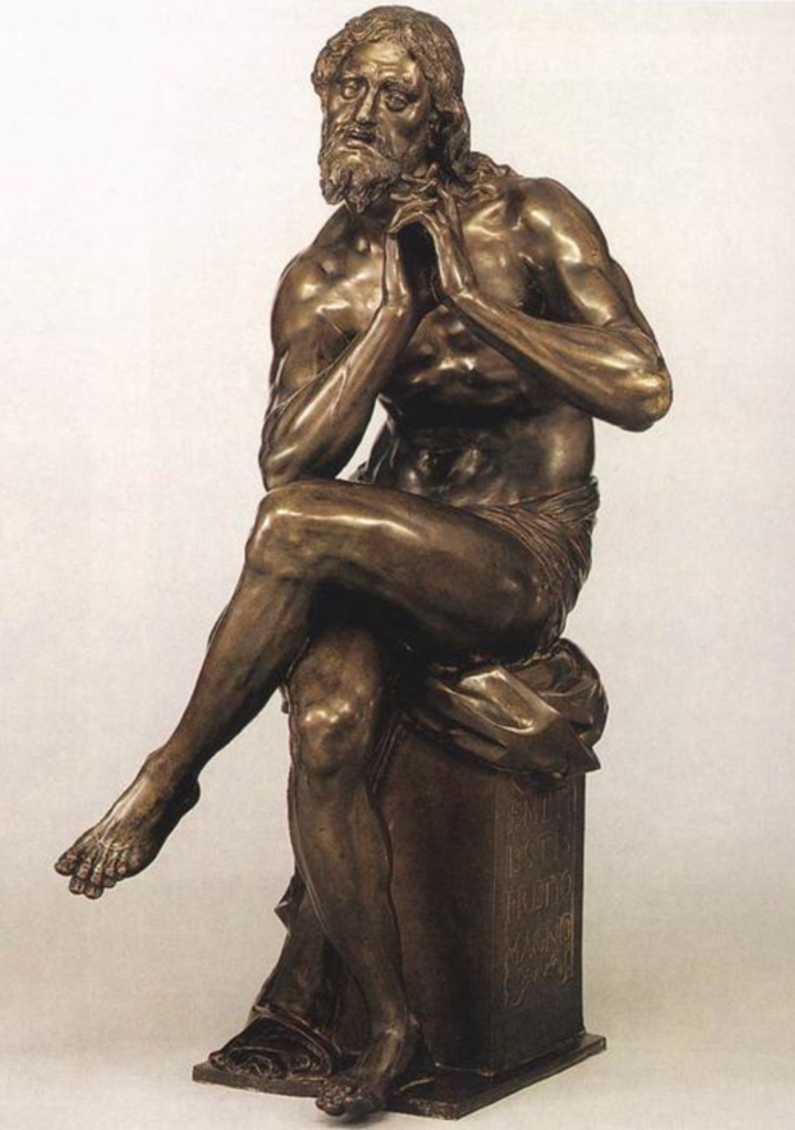 A bronze old sitting man statue
