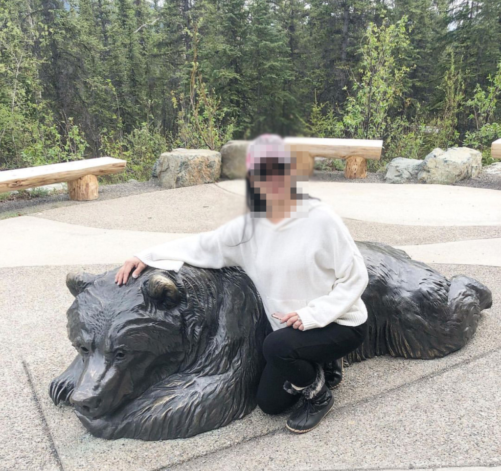 A charming bronze bear sculpture