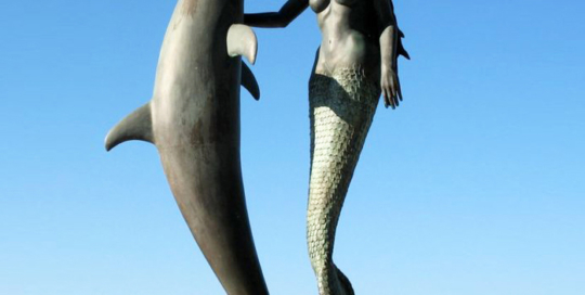 life size mermaid with dolphin
