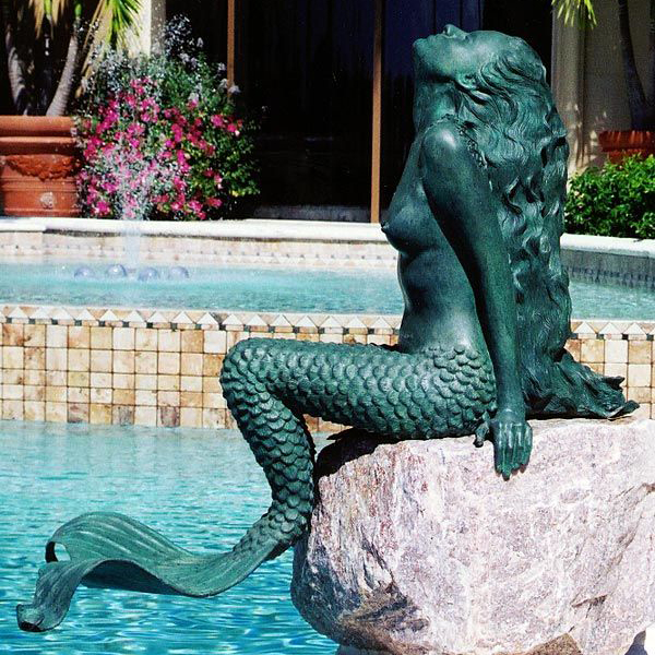 swiming pool mermaid statue
