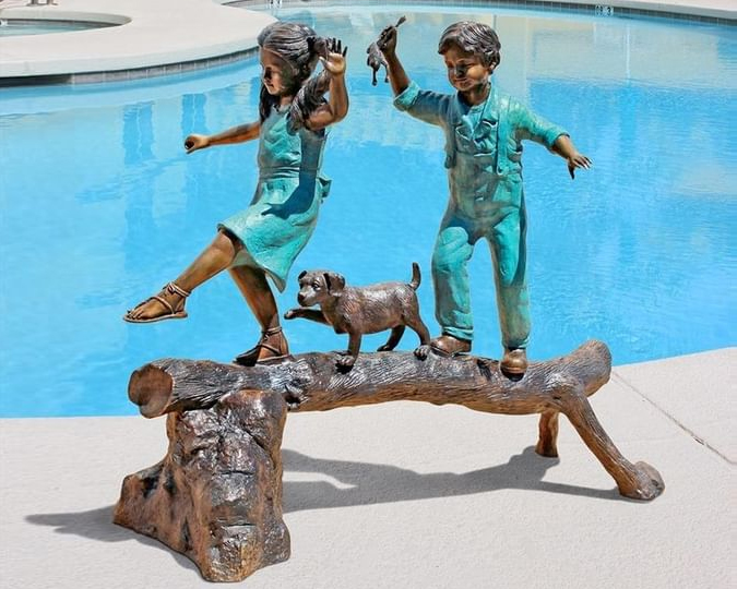 boy and girl outdoor statues