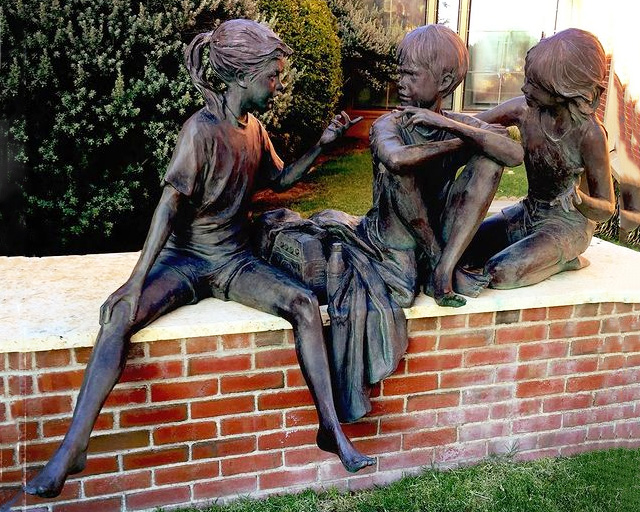 boy and girl statues