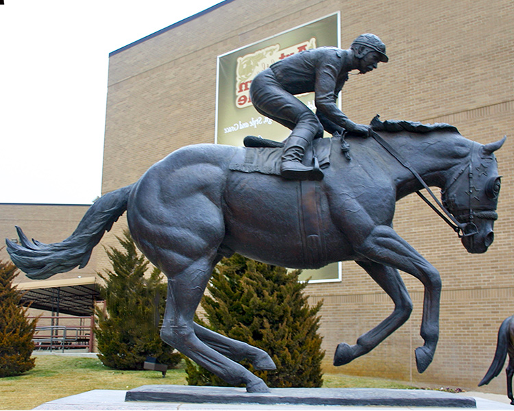 man horseback riding sculpture