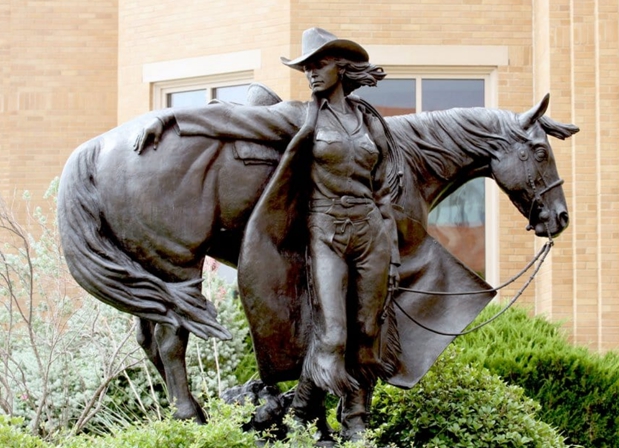 bronze cowgirl statue