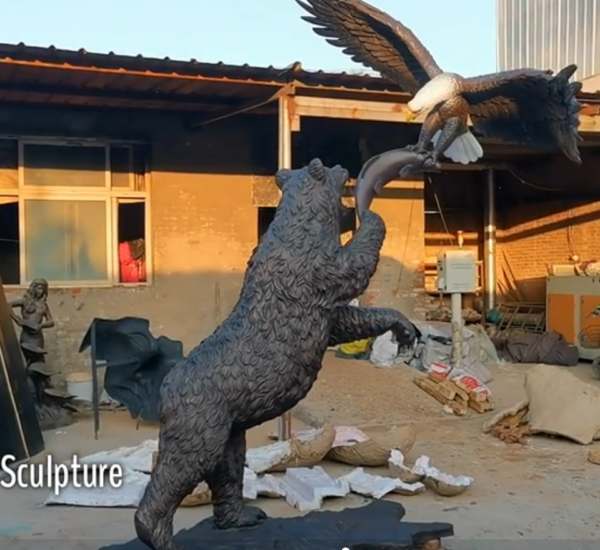 outdoor fighting bear and eagle statue