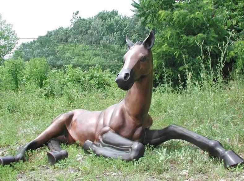resting horse sculpture