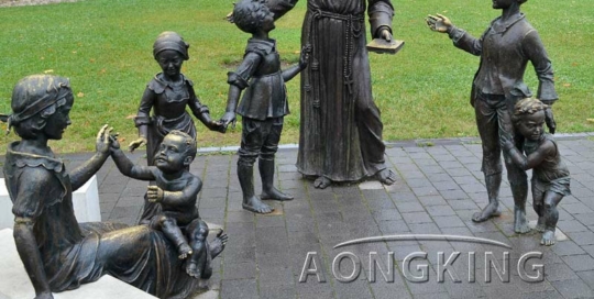 Bronze statues of Saint Anthony and children in front of Catholic Cathedral