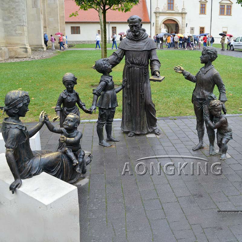 Bronze statues of Saint Anthony and children in front of Catholic Cathedral