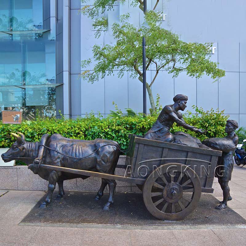 bronze worker carried the heavy bag onto the cart statue