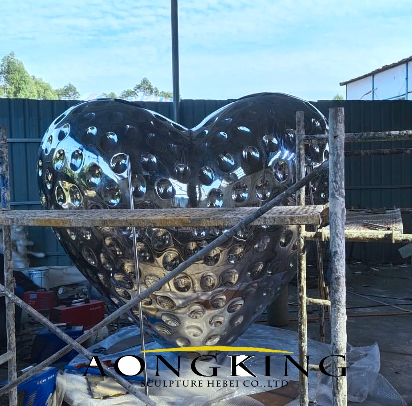 stainless steel gleaming heart sculpture