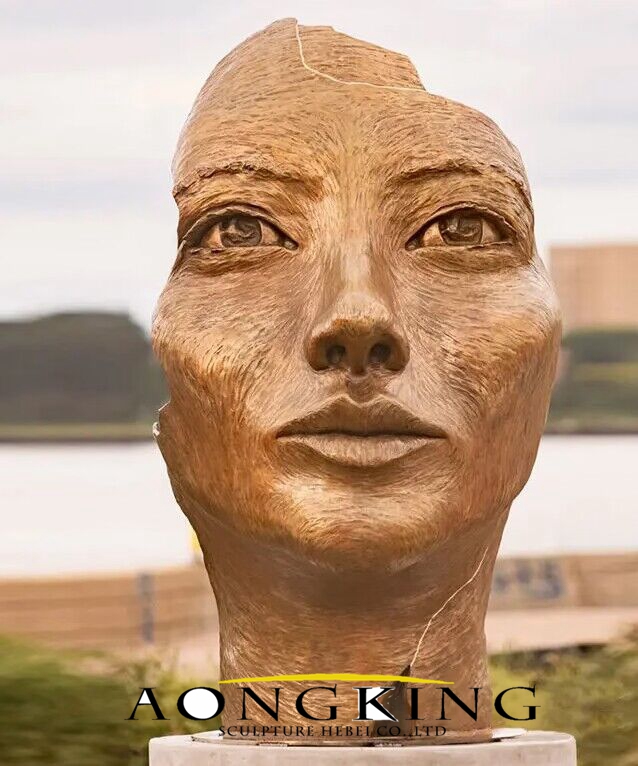 gold girl face sculpture