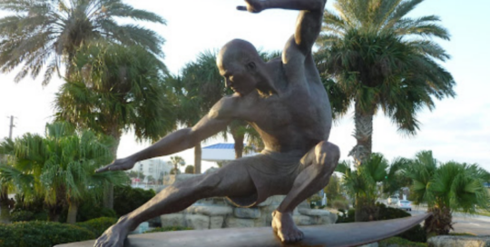 surfing statue bronze