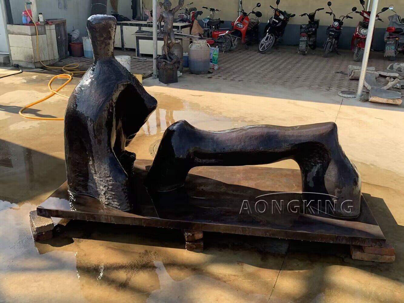 bronze sculpture of Reclining Figure Arch Leg