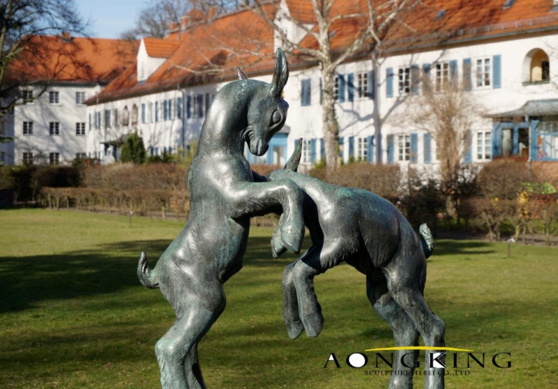 bronze lambs fighting sculpture