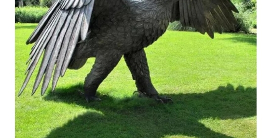 bronze walking eagle statue